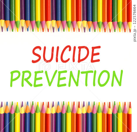 Suicide prevention symbol. Concept words Suicide prevention on beautiful white paper. Colored pencils. Beautiful white paper background. Psychological and suicide prevention concept. Copy space. Suicide prevention symbol. Concept words Suicide prevention on beautiful white paper. Colored pencils. Beautiful white paper background. Psychological and suicide prevention concept. Copy space. 122576664