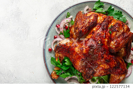 whole fried chicken, with spices, grilled chicken, on a light background, top view, homemade, no people, whole fried chicken, with spices, grilled chicken, on a light background, top view, homemade, no people, 122577134