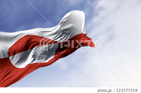 The flag of Greenland waving in the wind on a clear day. 122577259
