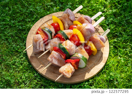 fresh raw chicken and vegetables skewers fresh raw chicken and vegetables skewers 122577295