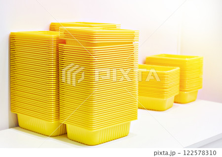 Yellow plastic food containers Yellow plastic food containers 122578310
