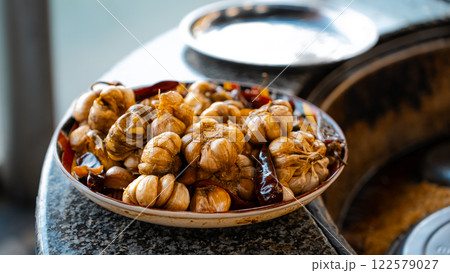 The concept of oriental cuisine. Assorted Uzbek food set, pilaf, samsa, lagman, manta, shurpa central asia food. Homemade Uzbek pilaf or plov from lamb served in cast iron cookware 122579027