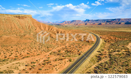 Aerial of Red Rock Desert and Winding Road in Utah 122579083