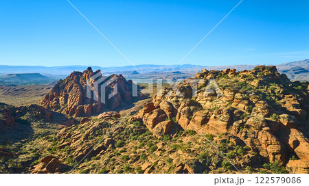 Aerial Red Rock Formations and Desert Valley in Utah Snow Canyon 122579086