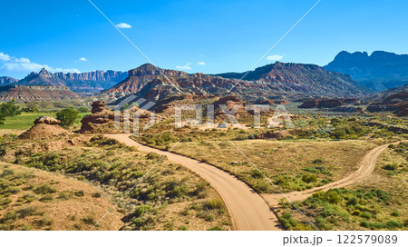 Aerial of Rugged Desert Terrain with Red Rock Formations in Utah Aerial of Rugged Desert Terrain with Red Rock Formations in Utah 122579089