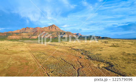 Aerial of Gooseberry Mesa Desert and Mountains in Golden Hour Light 122579096