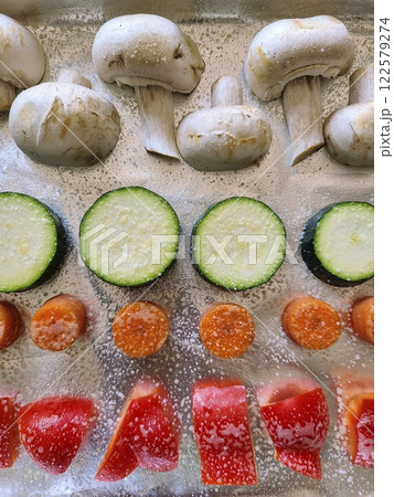 Fresh Vegetables on Baking Sheet Eye-Level Perspective 122579274