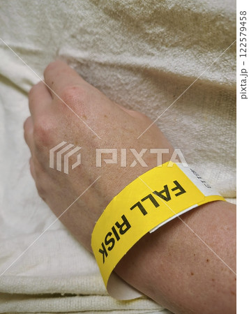 Fall Risk Wristband on Patient Wrist Eye-Level Perspective 122579458