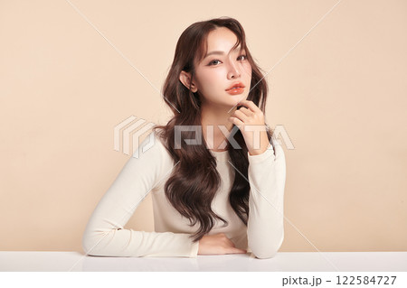 Beautiful young asian woman with clean fresh skin on beige background, Face care, Facial treatment, Cosmetology, beauty and spa, Asian women portrait. Beautiful young asian woman with clean fresh skin on beige background, Face care, Facial treatment, Cosmetology, beauty and spa, Asian women portrait. 122584727