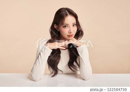 Beautiful young asian woman with clean fresh skin on beige background, Face care, Facial treatment, Cosmetology, beauty and spa, Asian women portrait. 122584730