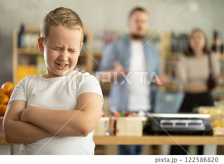 Capricious preteen boy screaming loudly in grocery store Capricious preteen boy screaming loudly in grocery store 122586820