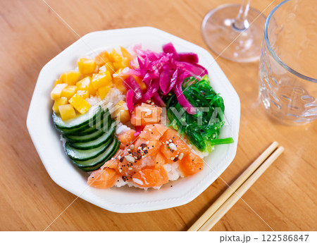 Poke with salmon, rice and seaweed Poke with salmon, rice and seaweed 122586847
