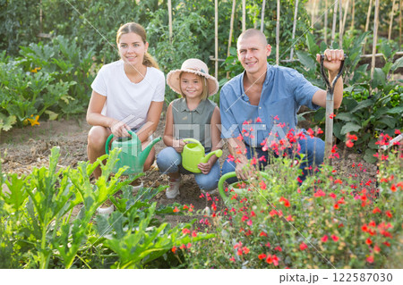 Family in kithcen garden 122587030