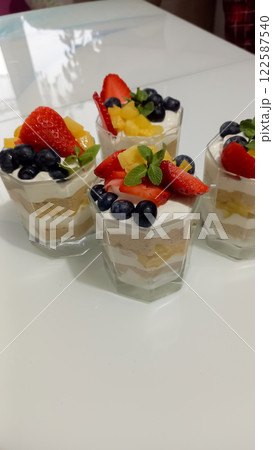 Dessert cake in a transparent cup with strawberries and cookies Dessert cake in a transparent cup with strawberries and cookies 122587540