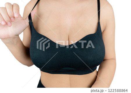 Woman with beautiful breasts, black bra isolated on white background, closeup. Woman with beautiful breasts, black bra isolated on white background, closeup. 122588864