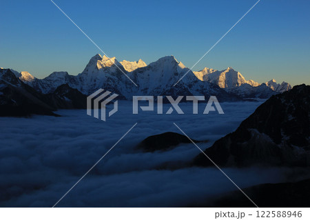 Kangtega, Thamserku and other mountains of the Himalayas at sunset, Nepal. Kangtega, Thamserku and other mountains of the Himalayas at sunset, Nepal. 122588946