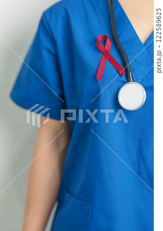 Doctor with Burgundy Red Ribbon for March multiple myeloma Cancer and December World Aids Day Awareness month. Healthcare and world cancer day concept Doctor with Burgundy Red Ribbon for March multiple myeloma Cancer and December World Aids Day Awareness month. Healthcare and world cancer day concept 122589625