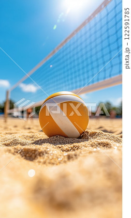 close up of beach volleyball on sandy ground, under bright sun 122591785