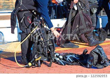 Anonymous diver prepares gear. Sports and equipment. Tourism and travel. Anonymous diver prepares gear. Sports and equipment. Tourism and travel. 122592053