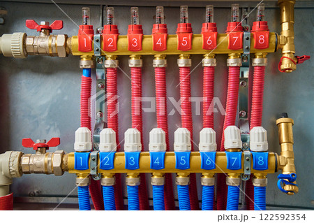 Underfloor heating manifold with valves and flow meters 122592354