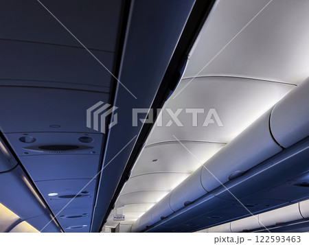 View of the airplane cabin with modern interior lighting. Traveling concept 122593463