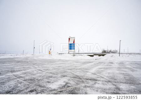 Empty road sign on Iceland road with snow capped field view in the winter. Mockup or Copy space. Nature, travel, winter background, or wallpaper Empty road sign on Iceland road with snow capped field view in the winter. Mockup or Copy space. Nature, travel, winter background, or wallpaper 122593855