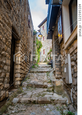 Narrow street in Ulcinj Old Town in Montenegro, the southernmost city at Montenegrin coast, Europe 122595104