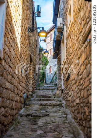 Narrow street in Ulcinj Old Town in Montenegro, the southernmost city at Montenegrin coast, Europe 122595105
