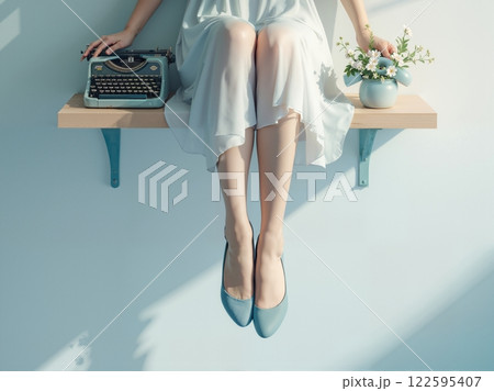 A woman in a light blue dress sits on a shelf 122595407
