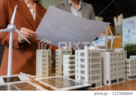 House model with agent asking costumer for contract to buy, get insurance or loan real estate or property. House model with agent asking costumer for contract to buy, get insurance or loan real estate or property. 122598884