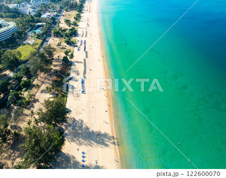 Amazing Top view sand beach landscape background,Summer sea waves crashing on sandy shore seascape background,Many travel people relax on beach at Phuket Thailand Amazing Top view sand beach landscape background,Summer sea waves crashing on sandy shore seascape background,Many travel people relax on beach at Phuket Thailand 122600070
