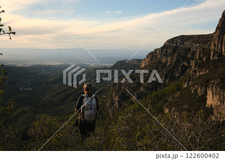 A woman from the back descending from the mountain 122600402
