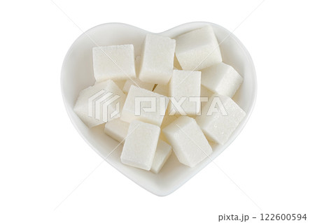 Sugar cubes in a ceramic bowl isolated on white background. Top view. Flat lay Sugar cubes in a ceramic bowl isolated on white background. Top view. Flat lay 122600594