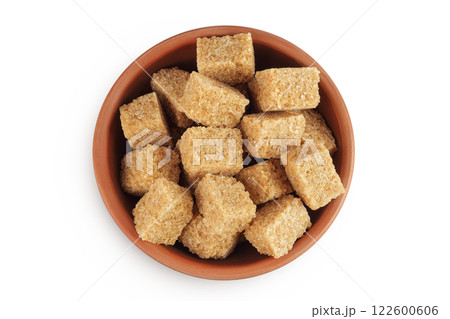 brown sugar in a ceramic bowl isolated on white background. Top view. Flat lay 122600606