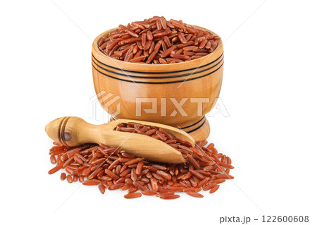 red rice in a wooden bowl isolated on white background 122600608