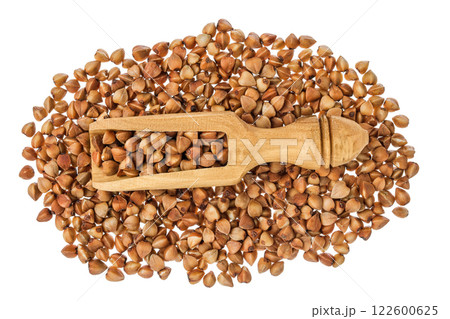 Raw buckwheat in wooden scoop isolated on white background. Top view. Flat lay Raw buckwheat in wooden scoop isolated on white background. Top view. Flat lay 122600625