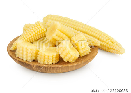 Pickled young baby corn cobs in wooden bowl isolated on white background 122600688