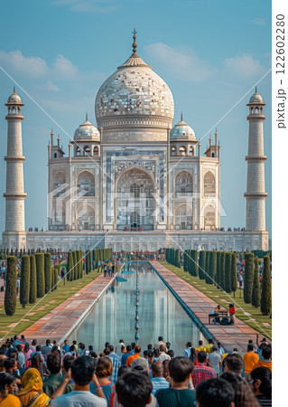 a stunning white marble mausoleum with intricate details, reflecting in the serene pool and framed by manicured gardens under a bright sky 122602280
