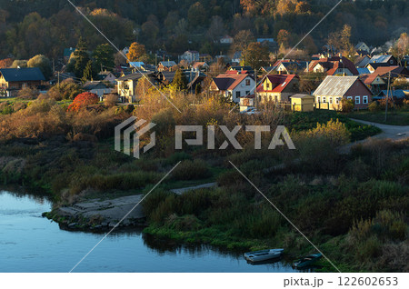 Small town Kraslava by the river Daugava in Latvia, boats in the river in foreground 122602653
