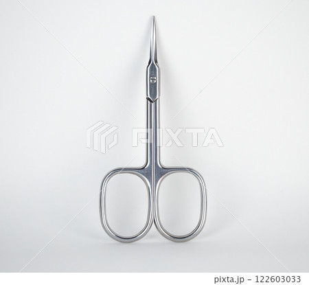 small scissors placed on a white surface 122603033