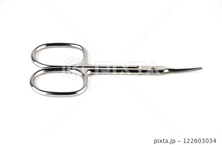 small scissors placed on a white surface small scissors placed on a white surface 122603034