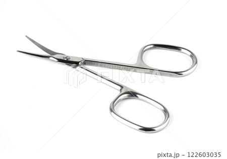 small scissors placed on a white surface 122603035