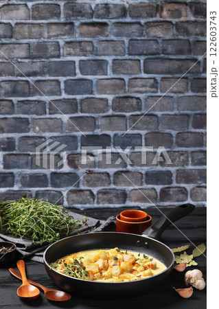 pollock cubes poached in cream saffron sauce 122603743