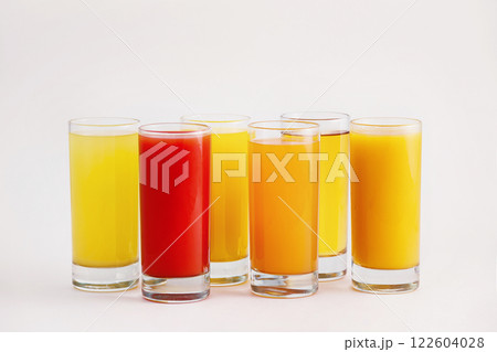 Full colorful glasses of fresh juice isolated at white background. 122604028
