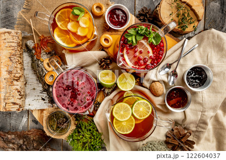 Top view image of various tea pots group at decorated with bakery and jam rural table background. 122604037