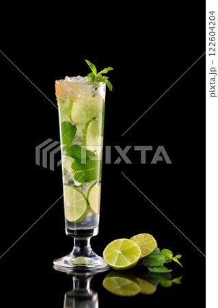 Closeup glass of fresh mojito cocktail with mint and lime isolated at black background. 122604204