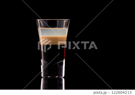 B 52 alcohol layered shooter cocktail isolated at black background. 122604213