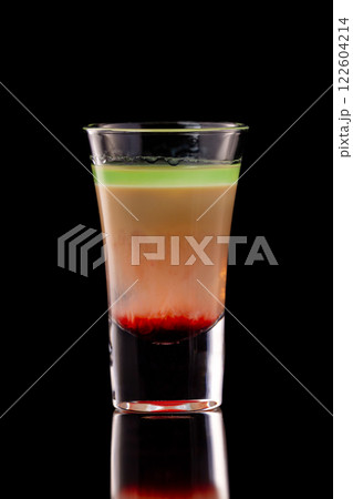 Hiroshima alcohol layered shooter cocktail isolated at black background. 122604214