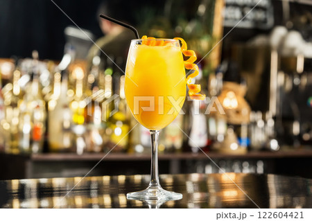Closeup glass of orange juice at bar counter background. 122604421