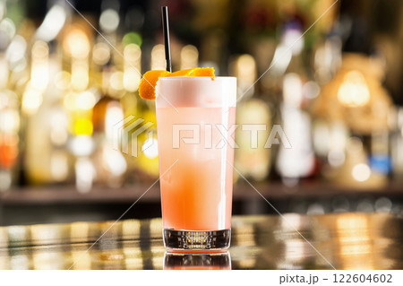 Closeup glass of fresh grapefruit juice at bar counter. Closeup glass of fresh grapefruit juice at bar counter. 122604602